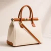 722d1af1f71f93323cc6c34fe6402d26d0ac714ebc7a4c5897f1ae34ef8e7e5b NORA – Tas van Italiaans dollaro-leer – Crème & Camel